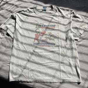 Vintage Sick Rick’s Elf Tossing Championships Graphic Funny Christmas Tee